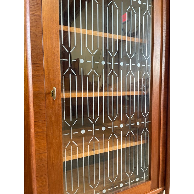 Danish Modern Corner Cabinet or Bar with glass doors. Shelves are not adjustable. 35w (front) 22d 49h each side is 25