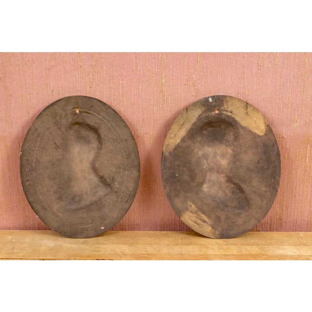 A large pair of unsigned thick brass presidential wall plaques of two of America’s most important and storied presidents:...