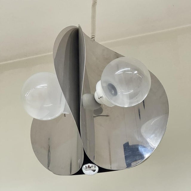 Space Age Pendant Lamp, Modernist Design, 1970s. Structure entirely in chromed steel with wavy edges, opalescent glass...