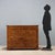 Walnut chest of drawers with maple trim and alternating woods. Front with five drawers, the first two of which, placed...