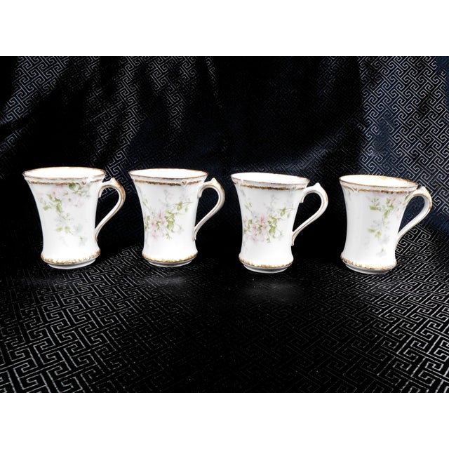 This is a lot of four Limoges Gerard, Dufraisseix & Abbot Limoges chocolate cups. Two cups have chips in the rim and they...