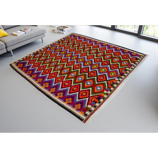 Hailing from the sun-drenched Mediterranean coast of Anatolia, this exceptionally vibrant Barak kilim is a stunning...