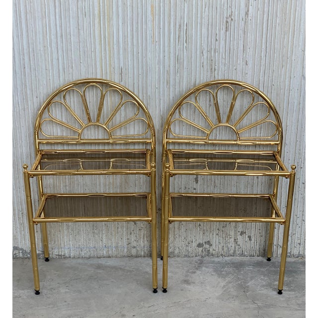 About Mid-Century Modern Italian Faux Bamboo Gilt Metal NightStands with Smoked Glass Total Height: 31in Height to high...