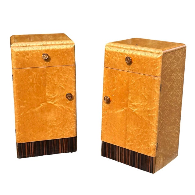 A pair of original matching Art Deco bedside cabinets in Birds Eye maple. Each having an internal shelf to the cupboards...