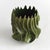 With a sculptural, luster effect, this unusual form of a vase truly captivates. Made of clay & finished with a highgloss...