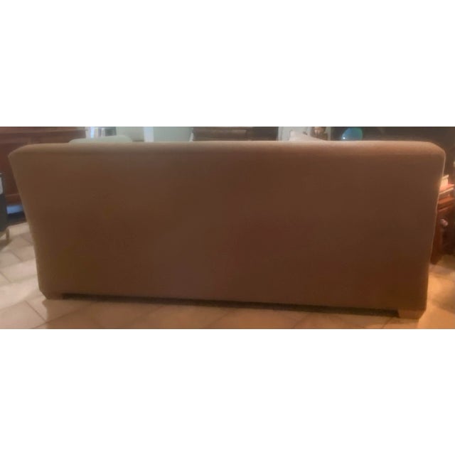 Architectural Kreiss tuxedo sofa manufactured by Cisco Brothers, featuring a substantial hardwood frame, down-wrapped...