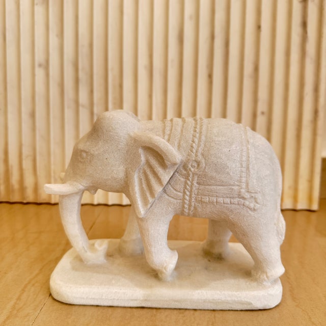 A charming pair of hand-carved marble elephants, crafted in India in the 2010s, embodying both artistry and cultural...