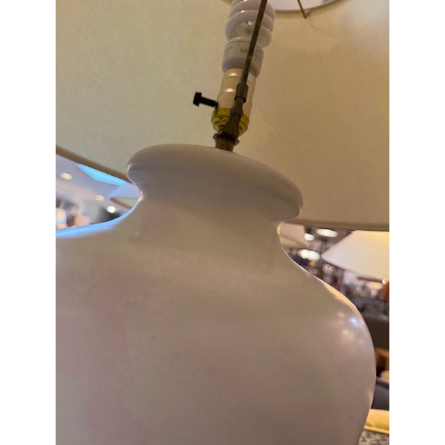 Design Plus Gallery presents a Pair of Ceramic Jug Style Table Lamps. The lamps have an eggshell color with a matte finish...