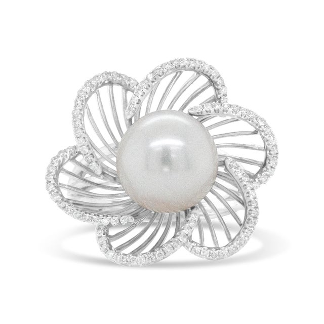 The timeless style of this stunning 14k white gold ring will always be in season. In a floral motif, this ring features an...