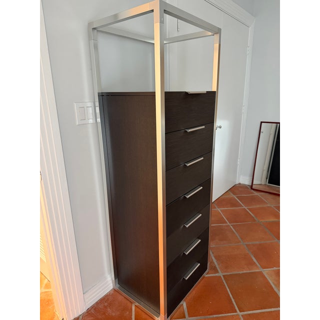 Didier Gomez designed 7-drawer dark brown wood tall chest of drawers with an anodized aluminum finish and drawer pulls....