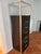 Didier Gomez designed 7-drawer dark brown wood tall chest of drawers with an anodized aluminum finish and drawer pulls....