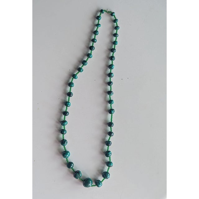 Graduated Malachite with glass beads 26" total legth. Purchased in the 70's from the Zaire (now the Congo). It is hand...