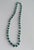 Graduated Malachite with glass beads 26" total legth. Purchased in the 70's from the Zaire (now the Congo). It is hand...