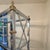 Vintage Hollywood Regency Chrome, Brass & Glass Étagère Five glass shelves inside a Maison Jansen style architectural...
