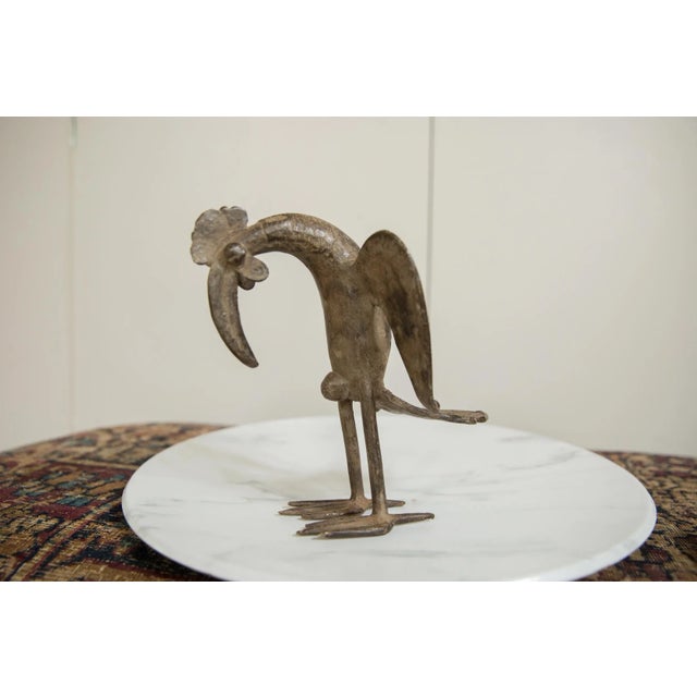 :: Vintage handmade African bronze bird. Circa mid 20th century and possibly older, each figure in this collection...