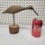 Charming hand-carved American folk art shore bird mounted on a rustic piece of bark-edged wood. The bird is delicately...