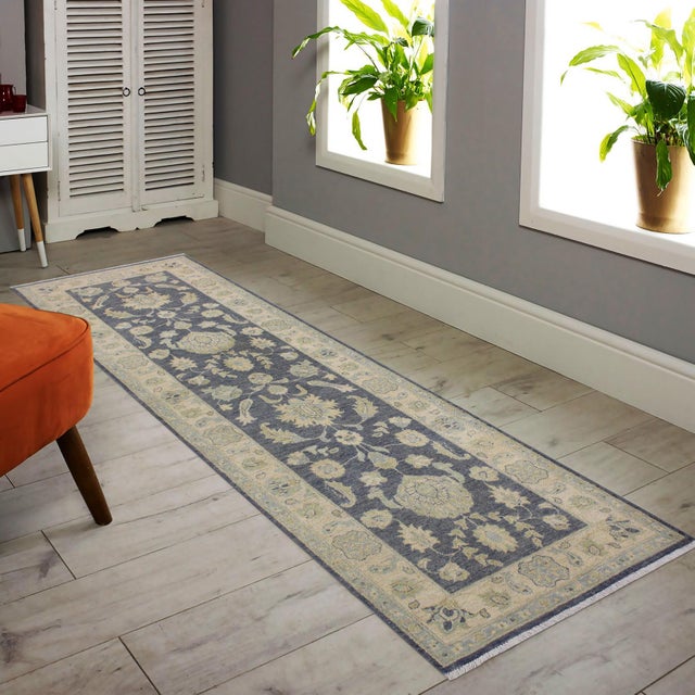 Enhance the ambiance of your home with this magnificent Persian-influenced Turkish hand-knotted rug made by skilled...
