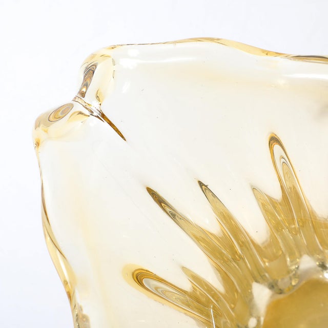 This Mid-Century Modernist Murano glass vase is a striking example of Murano's renowned craftsmanship from the 1960s,...