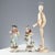 Pair of porcelain 'Gardeners' figurines, hand-decorated in polychrome. Underglaze blue mark. Cracks on the fingers. This...