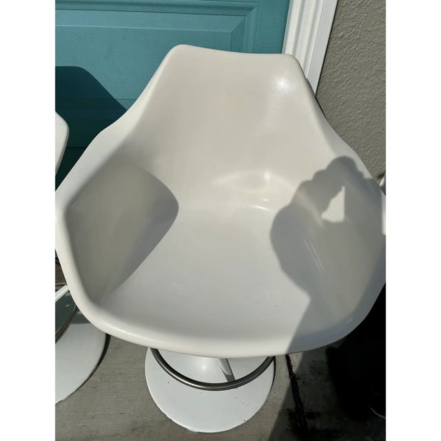 Set of 2 White Vintage Swivel Barstools with molded fiberglass shell seats and tulip-style bases from Chromodern, a chair...
