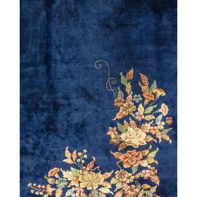 This striking Chinese Art Deco style rug, woven around 1920, exemplifies the elegance and distinctiveness of the era. It...