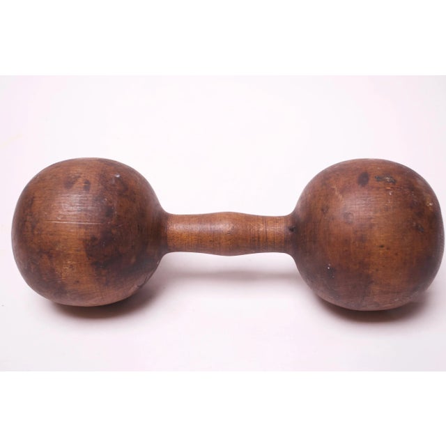 Circa 1940s, USA hand-carved dumbbell from one continuous piece of wood. Perfectly aged with rich patina / wear consistent...