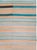 A vintage Turkish flatweave Kilim carpet in gallery format handmade during the mid-20th century with a striped pattern in...