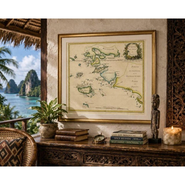This refined and historically significant 18th-century map of the Papuan Islands was engraved by the eminent French...