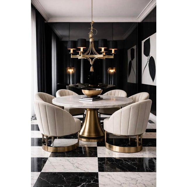 This is a late 20th century Hollywood Regency style gilt metal six arm chandelier. Each arm has a clip on reflection black...