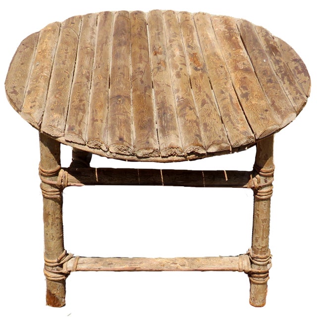 Rustic Adirondack style twig table with vine lashings. With its short stature, perfect for a small coffee table or side...