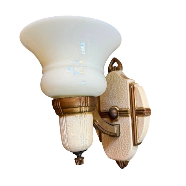 What a great pair of sconces! Hand painted design on cast iron has fabulous original patina. Backplate measures 4.5 inches...