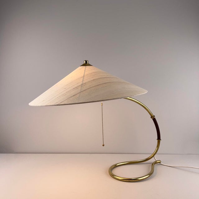 Beautifully curved brass frame with a newly made lampshade of wild silk. European Plug (up to 250V).The wiring of this...