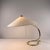 Beautifully curved brass frame with a newly made lampshade of wild silk. European Plug (up to 250V).The wiring of this...
