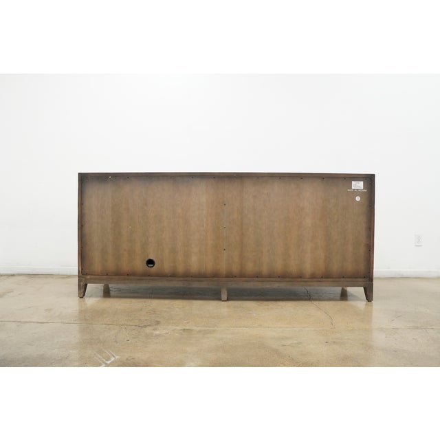 Fuse form with function with this beautiful, four-door credenza with bohemian-chic appeal. The outside features a...