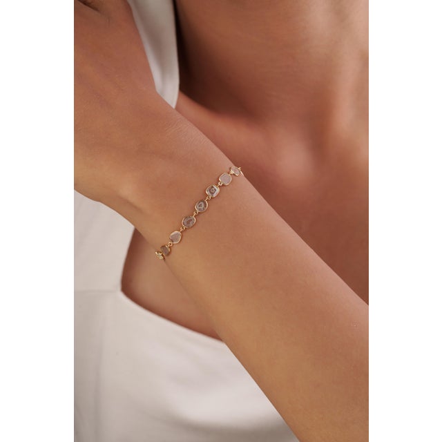 This station bracelet showcases 1.68 carats of natural uncut diamonds, set in 18K yellow gold. Each beautifully secured in...