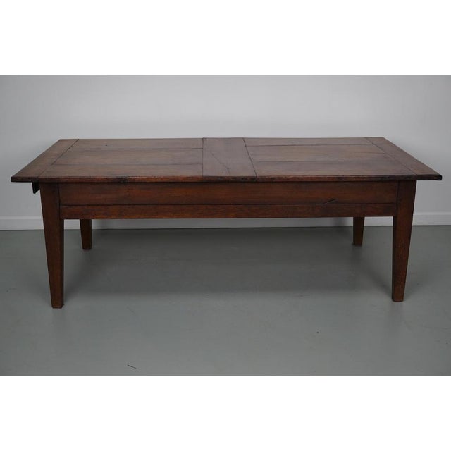 This coffee table was converted from an old oak farmhouse kitchen table. It retained a very nice patina and rich color...