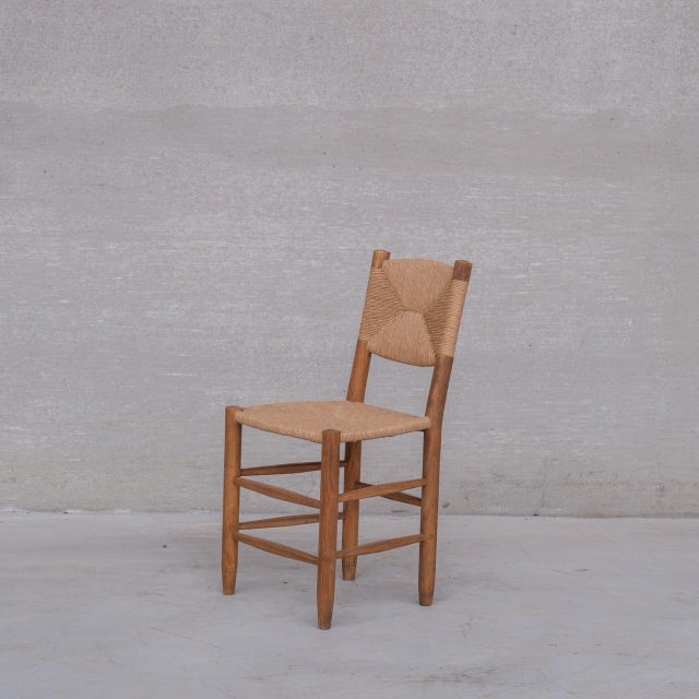 A scarce set of original bauche chairs by esteemed designer charlotte perriand. france, c1940s. ash frames. edition bcb....