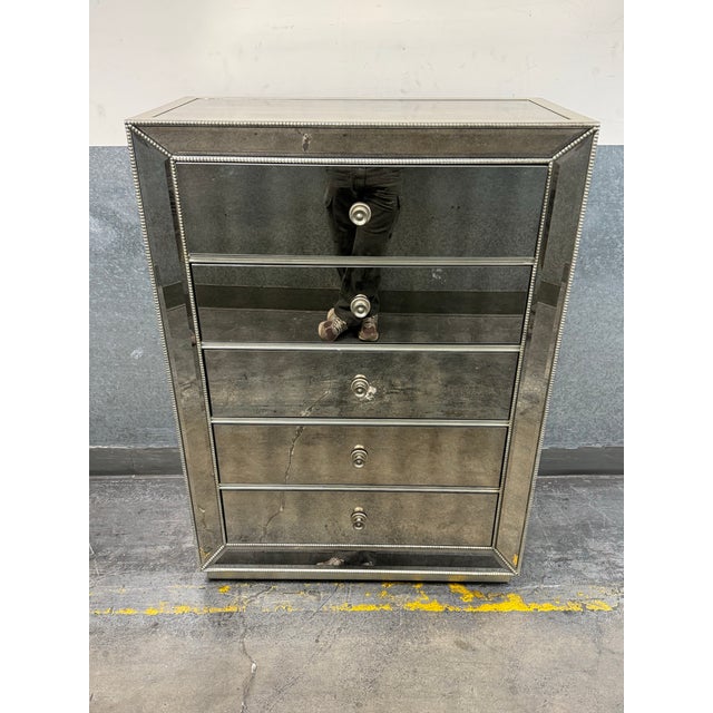 Design Plus Gallery presents the Omni Mirrored 5 Drawer Chest from Z Gallerie. This tall chest is wrapped in antiqued...
