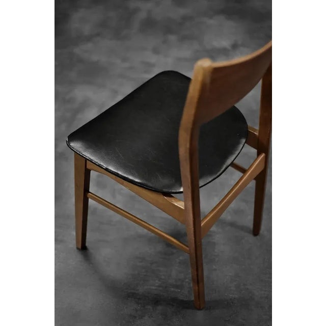 This set of four chairs was made in Denmark during the 1960s. The frame is made of beech wood in a warm shade of brown....