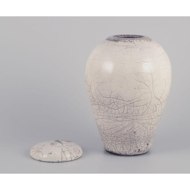 Anita Wederbrand, Swedish studio ceramist. Ceramic from Äsperöd, Sweden. Unique lidded vase/jar. Raku-fired clay in sand-...