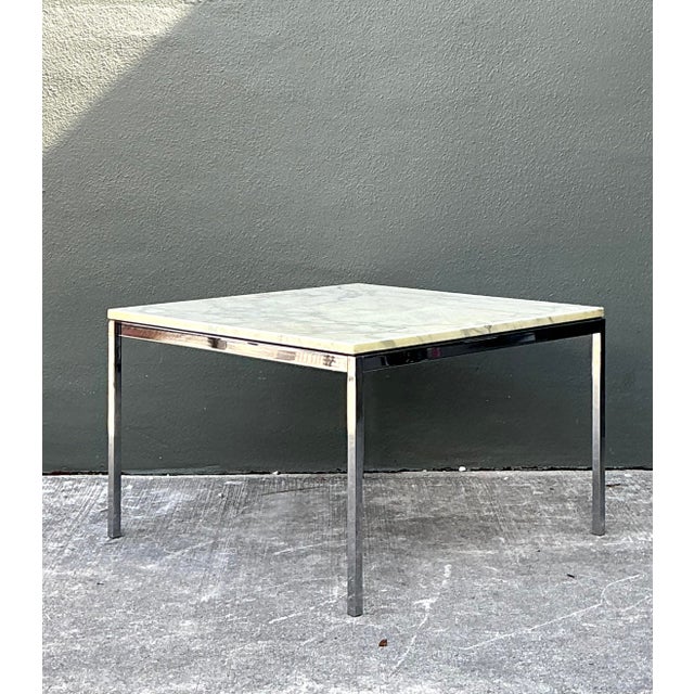 This authentic Florence Knoll side table, produced by KnollStudio, is a quintessential piece of Mid-Century Modern design....