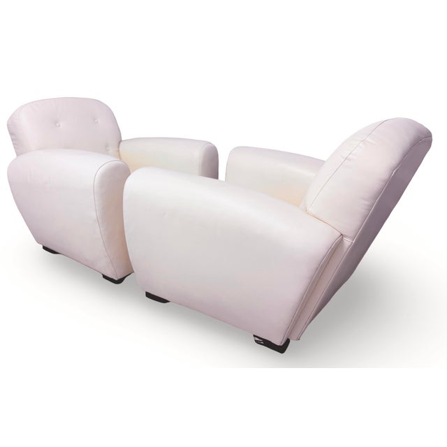 Exclusive vintage Ralph Lauren blue label leather club chairs, featuring an off-white leather covering accented with...