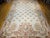 This elegant vintage French Aubusson tapestry rug features a classic allover floral bouquet design rendered in a refined,...