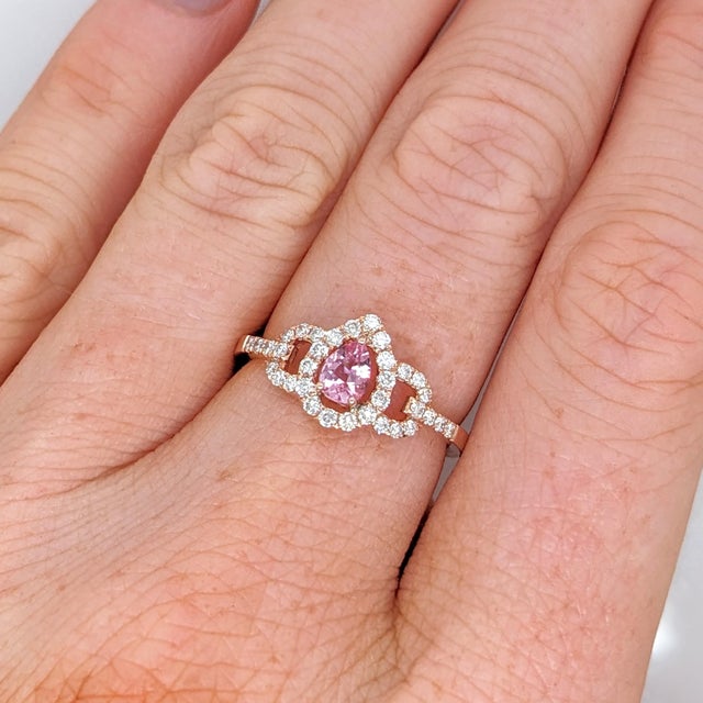 This is part of Chairish’s Fine Jewelry assortment. This beautiful ring features a 0.34 carat pear shape Imperial Topaz...