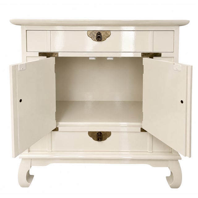 A beautifully crafted vintage Asian-inspired cabinet featuring a timeless silhouette and elegant brass hardware. Finished...