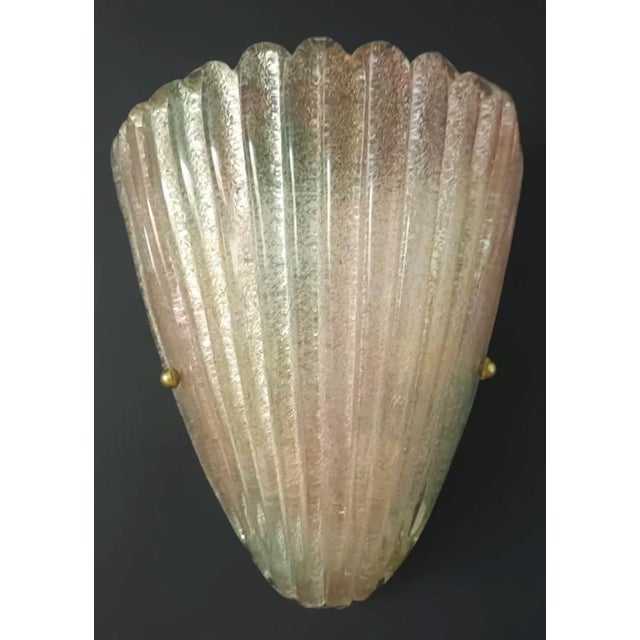 Italian wall light with textured Murano glass shield hand blown with rainbow colored Graniglia to produce granular...