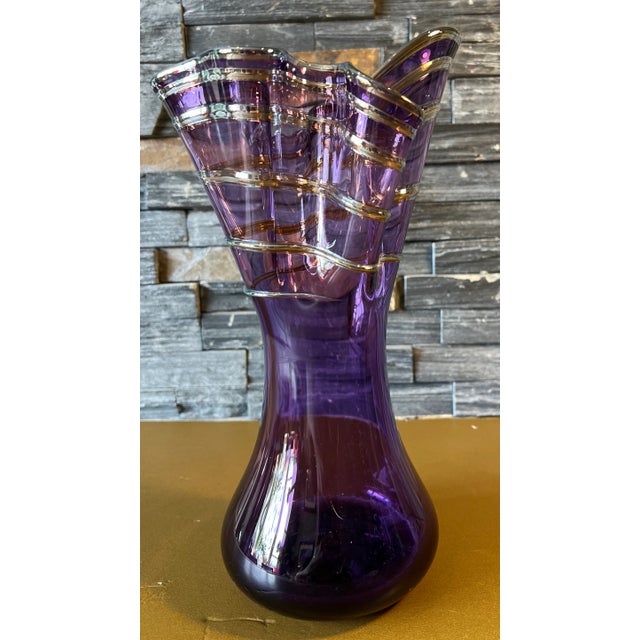 Hand blown from lustrous amethyst glass, this Art Glass Vase bears the imprint of skilled hands. Applied Iridescent amber-...