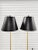 Sleek pair of vintage trumpet form brass floor lamps with sleek and stylish lines. The floor lamps seat on a black square...
