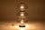 This vintage floor lamp is a true statement piece for any interior. It features three chrome rings and three smoked glass...
