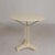 This bistro table served for years on the terrace of a French café. There is a round hole in the center of the tabletop...